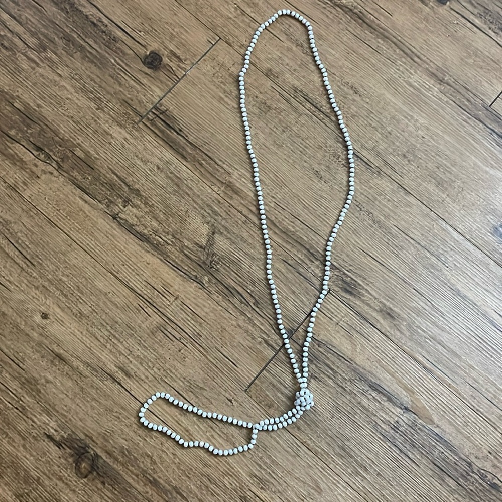 Long white iridescent bead necklace